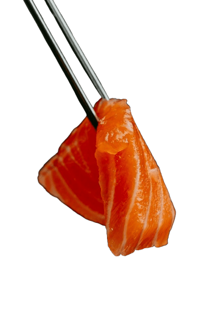 Fresh salmon sashimi held with chopsticks